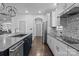 Modern kitchen with stainless steel appliances and gray cabinets at 12904 Vermillion Xing, Huntersville, NC 28078