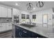 Modern kitchen with a large island, gray cabinets, and a stylish sink at 12904 Vermillion Xing, Huntersville, NC 28078