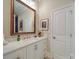 Bathroom with white vanity and large ornate mirror at 168 Tanglewood Cv, Belmont, NC 28012