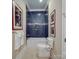 Elegant bathroom with blue tile, a soaking tub, and modern fixtures at 168 Tanglewood Cv, Belmont, NC 28012