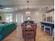 Bright dining room with hardwood floors and a view into the living room and kitchen at 168 Tanglewood Cv, Belmont, NC 28012