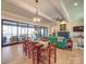 Dining room with hardwood floors, large windows, and view of screened porch at 168 Tanglewood Cv, Belmont, NC 28012