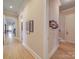 Light and bright hallway with hardwood floors and framed art at 168 Tanglewood Cv, Belmont, NC 28012