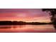 Stunning sunset over the lake with colorful sky at 168 Tanglewood Cv, Belmont, NC 28012