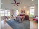 Bright main bedroom with large windows and sitting area at 168 Tanglewood Cv, Belmont, NC 28012