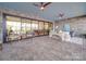 Spacious screened porch with comfortable seating and kitchen views at 168 Tanglewood Cv, Belmont, NC 28012