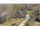 Aerial view of a two-story brick home and its surroundings at 2050 Stoney Creek Nw Dr, Concord, NC 28027