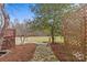 Stone pathway leads to a tranquil backyard with wooden arbor at 2050 Stoney Creek Nw Dr, Concord, NC 28027