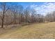 Large backyard, mostly grass, with a tree line in the background at 2050 Stoney Creek Nw Dr, Concord, NC 28027