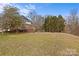 Home's backyard with deck and grassy area at 2050 Stoney Creek Nw Dr, Concord, NC 28027