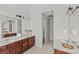 Double vanity bathroom with a view down the hallway at 2050 Stoney Creek Nw Dr, Concord, NC 28027