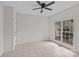 Neutral bedroom with tile floors, a ceiling fan and a window with a backyard view at 2050 Stoney Creek Nw Dr, Concord, NC 28027