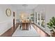 Bright dining room with hardwood floors and large windows at 2050 Stoney Creek Nw Dr, Concord, NC 28027