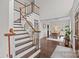 Elegant two-story entryway with hardwood floors and a staircase at 2050 Stoney Creek Nw Dr, Concord, NC 28027