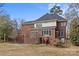 Brick house with a large deck and a sunroom at 2050 Stoney Creek Nw Dr, Concord, NC 28027