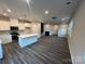 Modern kitchen featuring white cabinets, island, and stainless steel appliances at 208 Laura Elizabeth Ln, Clover, SC 29710