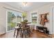 Cozy dining area with a rustic wooden table and leather stools at 209 S Gregory St, Lancaster, SC 29720