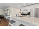 Modern kitchen with white cabinets, granite countertops, and stainless steel appliances at 209 S Gregory St, Lancaster, SC 29720