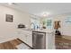 Modern kitchen with white cabinets, granite countertops, and island seating at 209 S Gregory St, Lancaster, SC 29720