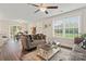 Bright living room with hardwood floors, comfy sofas, and a large window at 209 S Gregory St, Lancaster, SC 29720