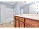 Bathroom featuring double vanity with wood cabinets, a bathtub/shower and tile floor at 2327 Axford Ln, Matthews, NC 28105