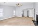 Large bedroom featuring neutral walls, carpeted floors, and plenty of natural light at 2327 Axford Ln, Matthews, NC 28105