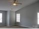 Bright bedroom with large windows and vaulted ceiling at 2327 Axford Ln, Matthews, NC 28105