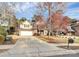 View of the home showcasing its brick and siding exterior with the driveway and mailbox at 2327 Axford Ln, Matthews, NC 28105