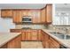 Kitchen featuring wooden cabinets, stainless steel appliances, countertops, and a double sink at 2327 Axford Ln, Matthews, NC 28105