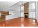 Bright living room featuring a stone fireplace, hardwood floors, and large windows at 2327 Axford Ln, Matthews, NC 28105