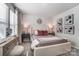 Serene bedroom with plush bedding, white walls, decorative art, and natural light creating a relaxing ambiance at 260 Laura Elizabeth Ln, Clover, SC 29710