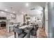 Open concept dining area flowing from kitchen, seamlessly blending into the living room at 260 Laura Elizabeth Ln, Clover, SC 29710