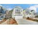 Charming exterior showcasing neutral siding, white garage doors, and neat landscaping at 260 Laura Elizabeth Ln, Clover, SC 29710