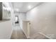 Bright hallway featuring neutral walls, carpet flooring, and access to a bedroom; natural light brightens the home at 260 Laura Elizabeth Ln, Clover, SC 29710