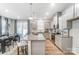 Bright kitchen with gray cabinets, granite countertops, and a view of the dining area at 260 Laura Elizabeth Ln, Clover, SC 29710