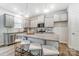 Modern kitchen featuring gray cabinets, granite countertops, and stainless steel appliances at 260 Laura Elizabeth Ln, Clover, SC 29710