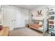 Charming Bedroom featuring a gray crib with orange accents, a play table, and ample storage space at 268 Laura Elizabeth Ln, Clover, SC 29710