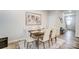 Dining room with a dark wood table and seating for six with a light-colored area rug at 268 Laura Elizabeth Ln, Clover, SC 29710