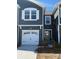 Modern two-story townhome with gray siding, white garage door, and landscaping at 280 Laura Elizabeth Ln, Clover, SC 29710