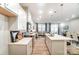 Bright, open kitchen with stainless steel appliances and quartz countertops flows into the living area at 280 Laura Elizabeth Ln, Clover, SC 29710