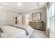 Well-lit main bedroom featuring a light gray color scheme and a view into the ensuite bathroom at 280 Laura Elizabeth Ln, Clover, SC 29710