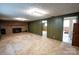 Large basement featuring a brick fireplace and a door leading to the bathroom at 2905 Maryland Ave, Kannapolis, NC 28083