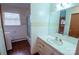 Bathroom features a vanity with a white countertop, and a tub shower at 2905 Maryland Ave, Kannapolis, NC 28083