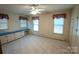 Spacious bedroom features neutral carpet, double windows, and built-in shelves at 2905 Maryland Ave, Kannapolis, NC 28083