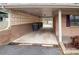 Attached carport with a brick wall at 2905 Maryland Ave, Kannapolis, NC 28083