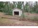 Detached garage with a concrete driveway and a wooded lot at 2905 Maryland Ave, Kannapolis, NC 28083