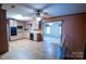 Neutral kitchen features tile floors, dark appliances, and pass through window at 2905 Maryland Ave, Kannapolis, NC 28083