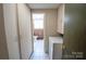 A well-lit laundry area with washer, dryer, and storage cabinets at 2905 Maryland Ave, Kannapolis, NC 28083