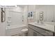 Bathroom with tub, shower, vanity with sink and shelves at 2953 Penninger Cir, Charlotte, NC 28262