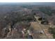 Aerial view showcases this home's location within a picturesque wooded community at 298 Upper Stanley Rd, Stanley, NC 28164